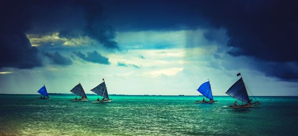 Man in sea against sky