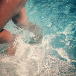 Low section of woman in swimming pool