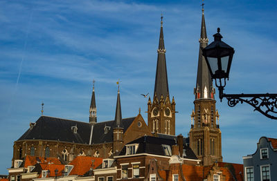 Low angle view of buildings in city against sky