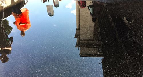 Reflection of buildings in puddle