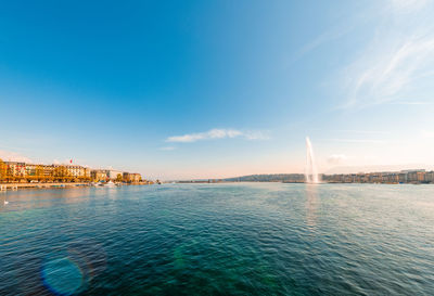 View of sea against buildings in city