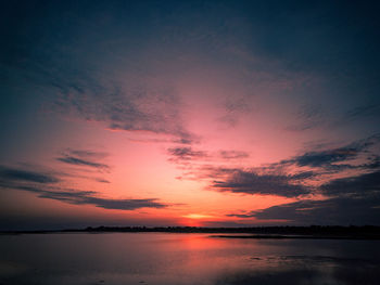 Scenic view of sea against romantic sky at sunset