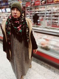 Portrait of woman standing outdoors