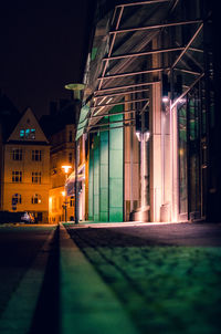 Illuminated building in city at night