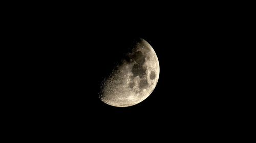 Low angle view of moon against sky at night