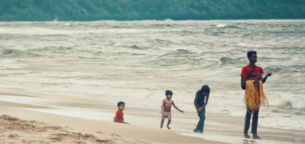 People walking on beach