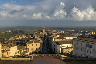 High angle view of buildings in town against sky