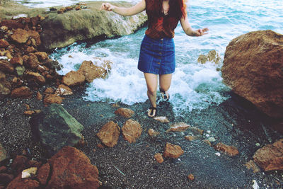 Low section of people standing on rocks