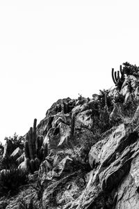 Low angle view of rock formation against sky