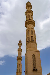 Low angle view of bell tower against sky