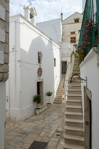 Staircase by building against sky