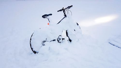 Snow on field against sky