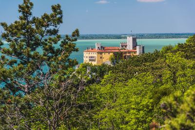 Gulf of trieste. high cliffs between boats, karst rocks and ancient castles. duino. italy