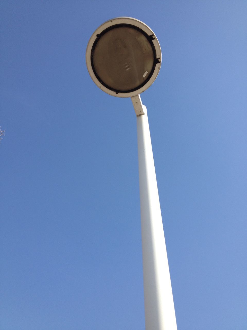 blue, low angle view, copy space, clear sky, street light, lighting equipment, built structure, day, no people, architecture, building exterior, airplane, sky, outdoors, technology, transportation, high section, part of, metal, electric light