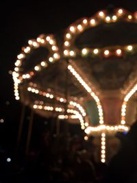 Close-up of illuminated christmas lights at night