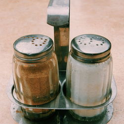 Close-up of salt and pepper shaker on table