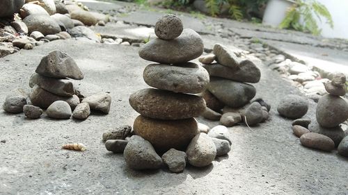 Stack of pebbles on sand at beach