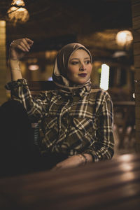 Portrait of a young woman looking away