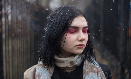 Close-up of beautiful young woman with eyes closed