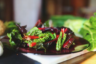 Close-up of chopped vegetables in plate on table