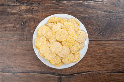 White plate with cornbread on a wooden table. healthy food.