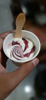 Midsection of person holding ice cream