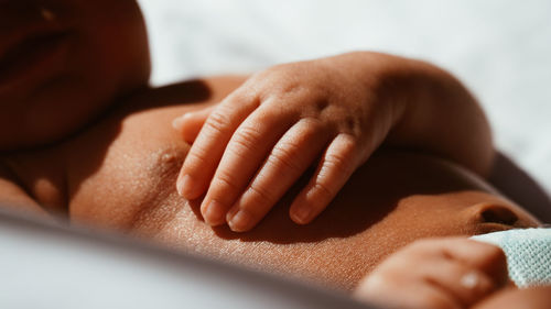 Close-up of person hand on cutting board