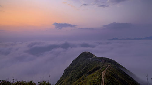 Scenic view of silhouette mountain against sky at sunset