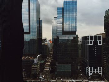 Buildings in city against sky