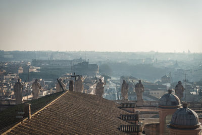 High angle view of city buildings against clear sky