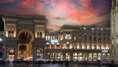 Illuminated building against sky