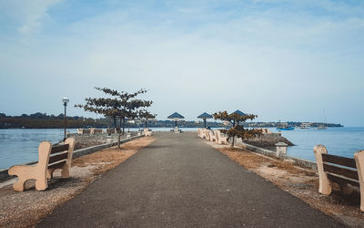 Pier over sea against sky