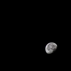 Scenic view of moon against clear sky at night