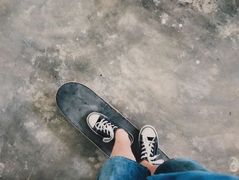 High angle view of person standing on skateboard 