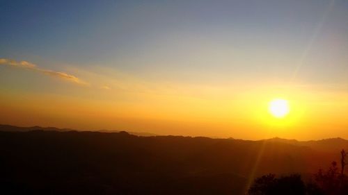 Scenic view of silhouette landscape against sky during sunset