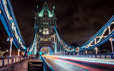 Light trails on suspension bridge at night