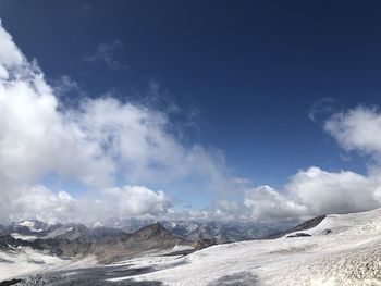 Scenic view of snowcapped mountains against sky