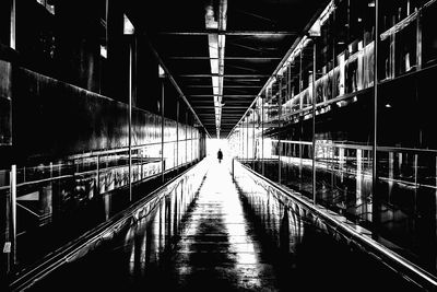 Illuminated footbridge at night