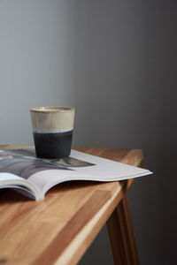 Close-up of coffee cup on table