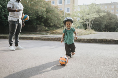 Father and daughter spending time actively outdoors