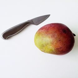 Close-up of apple over white background