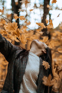 Autumn anxiety, mental health. happy brunette woman enjoy life in autumn forest