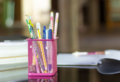 Close-up of multi colored pencils on table