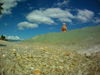 Surface level of woman at beach 