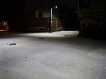 View of empty road in city at night