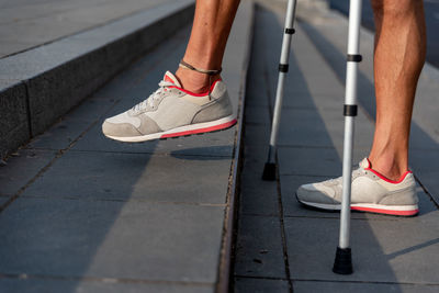 Low section of people walking on footpath