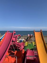 High angle view of slides at beach against sky