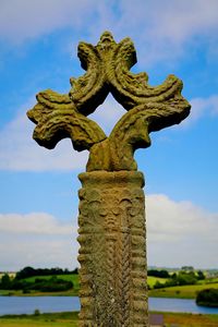 Low angle view of statue against sky