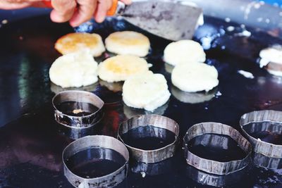 Close-up of person preparing food