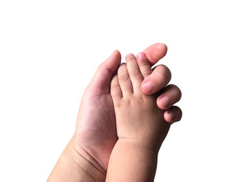 Close-up of woman hand over white background